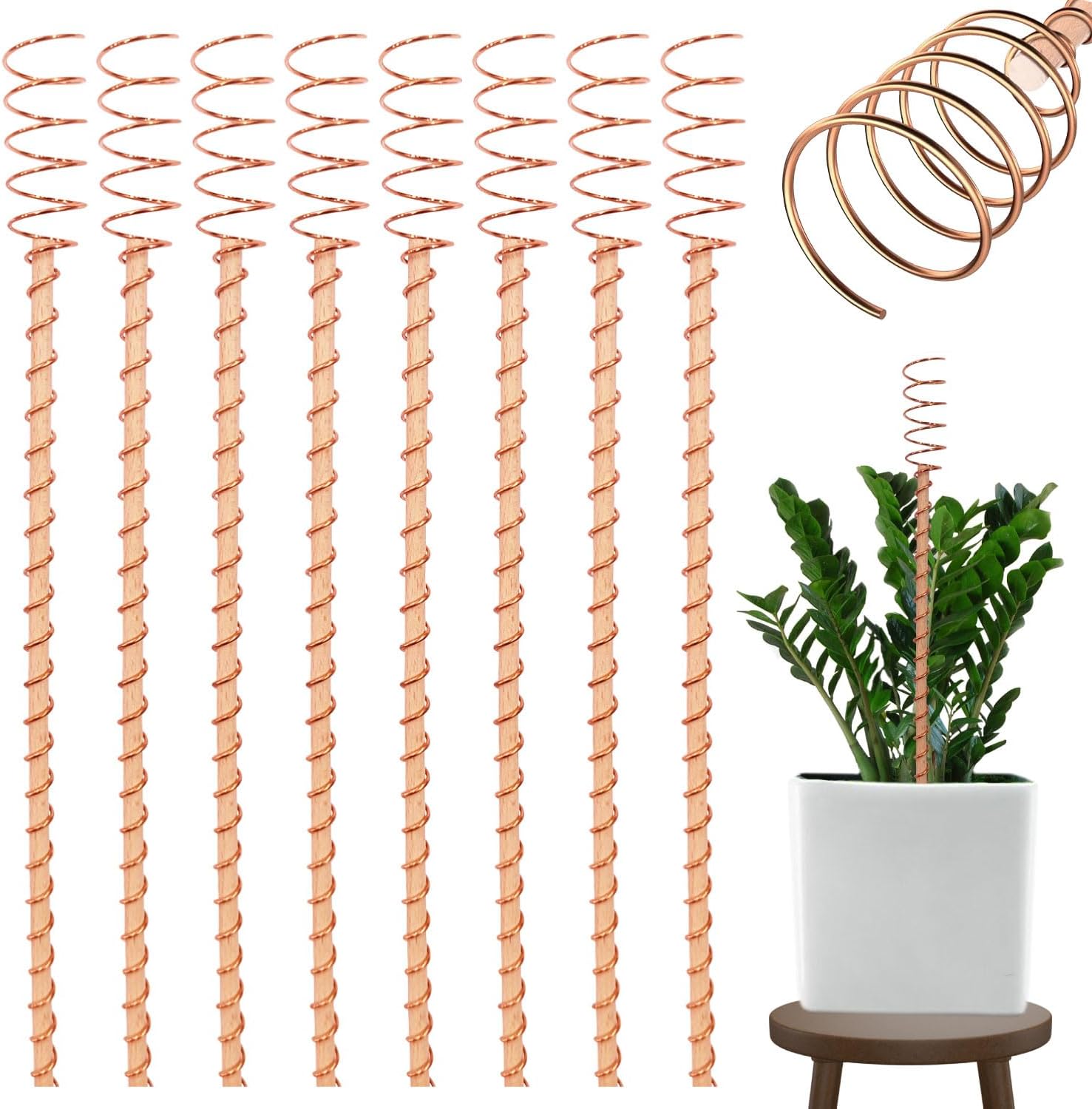 Set of eight copper garden stakes arranged on soil